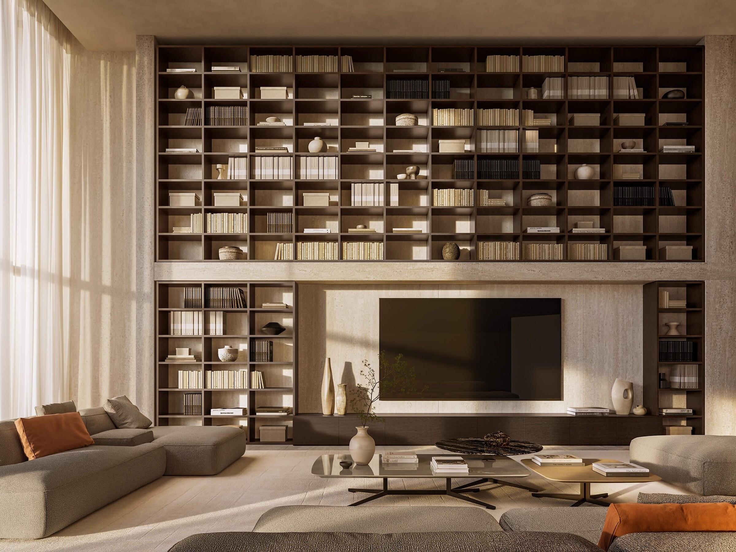 Wohnzimmer mit wandfüllendem Bücherregal, Sofas und niedrigem Couchtisch in warmem Licht