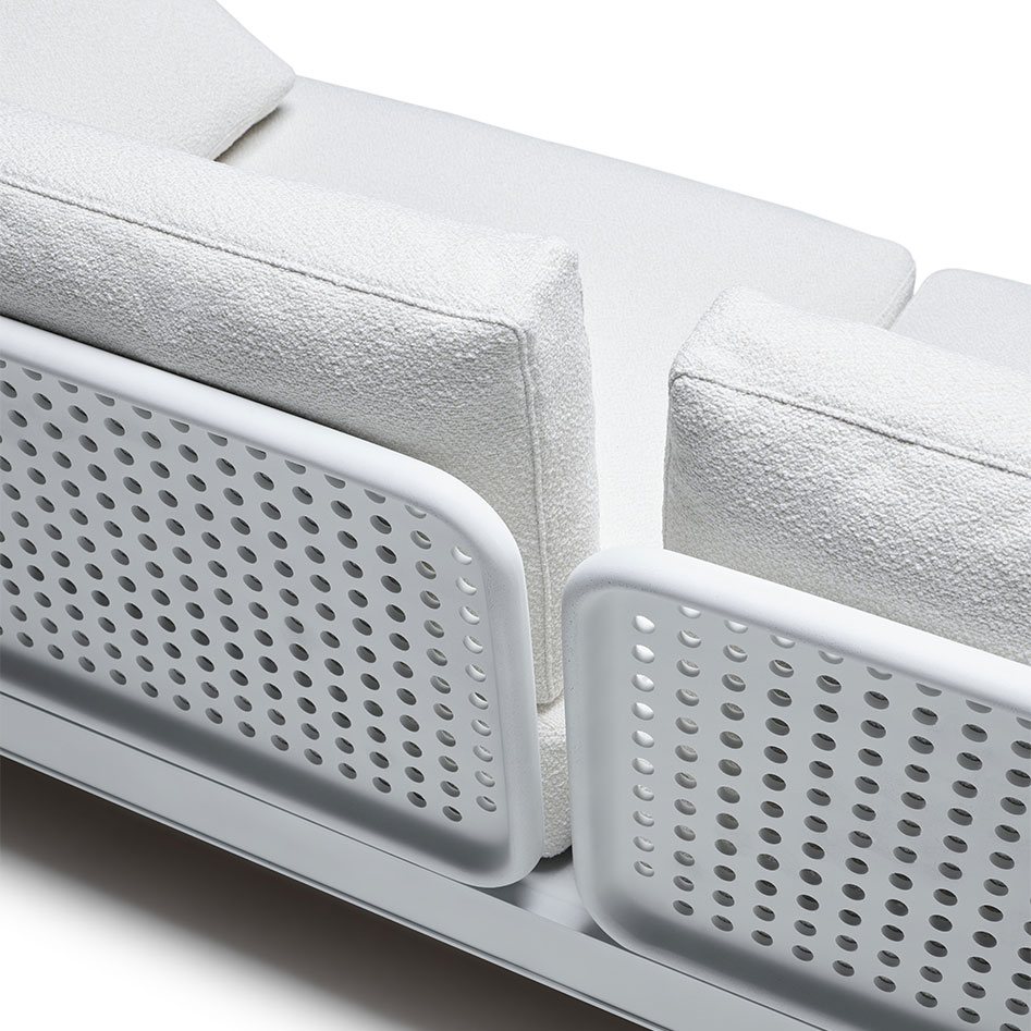 Detail des Knoll Sofas Lissoni mit hellen Polstern und weißem Geflecht  